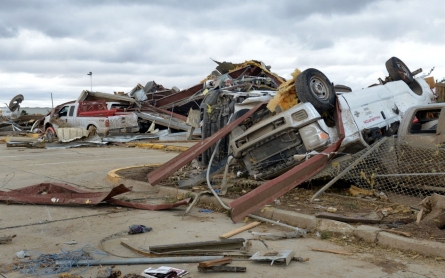 Dozens die as tornadoes, flooding and heavy snow hit Texas and Midwest 