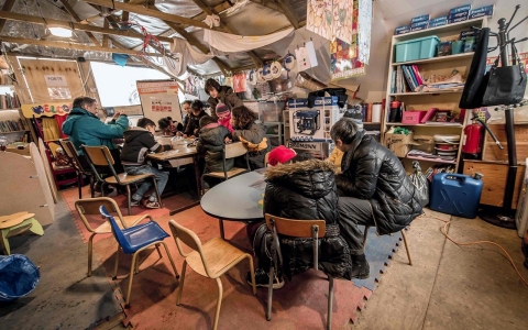 Migrant children attend a lesson in a makeshift school on Feb. 10, 2016, in the so-called Jungle migrant camp in Calais.