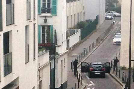 Hunt for gunmen after 12 killed in Paris attack on satirical magazine
