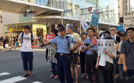In Japan, (politely) protesting to preserve a pacifist nation