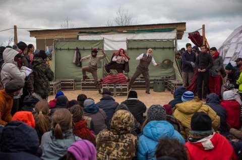 Actors from Shakespeare's Globe perform Hamlet for migrants at the Good Chance Theatre Tent in the Jungle refugee camp on Feb. 3, 2016 in Calais, France. 