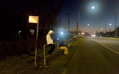 Erica Pendleton, 27, waits at a bus stop on Chef Mentor Highway in New Orleans East on Feb. 10, 2016.