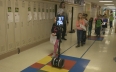 Meet the girl with a neurological disease who uses a robot for school