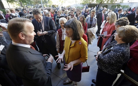 Kate Kelly, center, founder of Ordain Women, with a group of more than 150 women denied entrance to an all-male meeting of Mormon priesthood holders last Saturday.