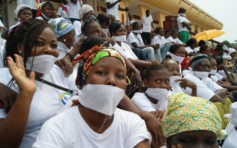 Women with their mouths covered 