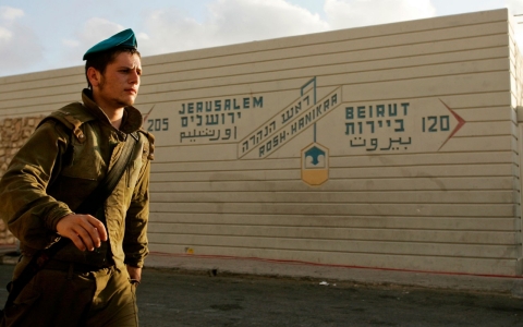 An Israeli solider walks past the Rosh Hanikra border crossing between Israel and Lebanon