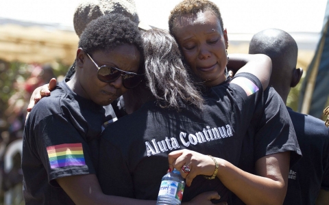 Members of the Ugandan gay community mourn at the funeral of murdured activist David Kato near Mataba, on January 28, 2011.