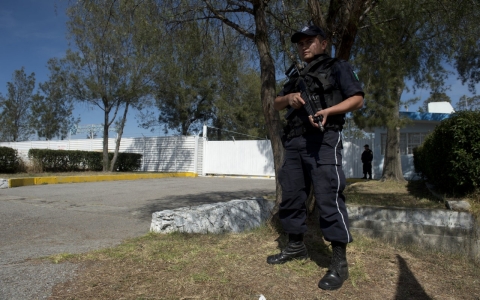 Federal policemen stand guard in front of Mexico's National Institute for Nuclear Research (ININ)