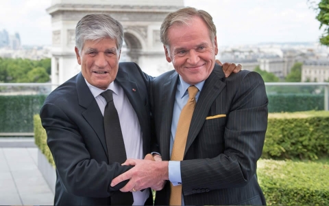 Publicis Group CEO Maurice Levy (L) embraces Omnicom Group CEO John Wren during a press conference on July 28, 2013 in Paris (Bertrand Langlois/AFP/Getty images)