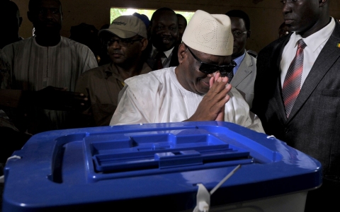 Keita gestures after casting his vote at a polling on Sunday in Bamako, the capital.