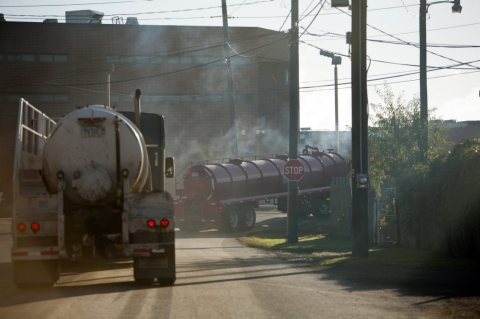 Trucks carry fresh water to natural gas wells being used in fracking.