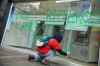 A Colombian student makes graffiti on a cash dispenser during a march in Bogota.