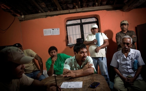 Bruno Placido, center, at the community police force base in Ayutla.