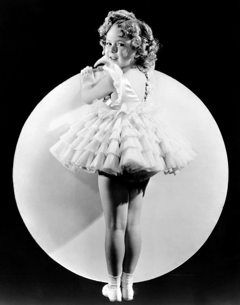 A young Shirley Temple poses for a promotional pictures. 