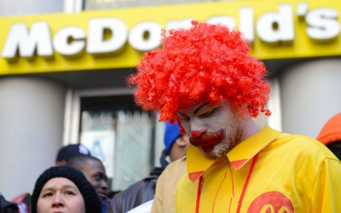 Fast-food workers calling for better wages demonstrate outside a McDonald's restaurant in NYC, NY, Tuesday.