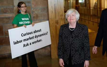 Fed chair cautious on timing of rate rises, questions health of job market