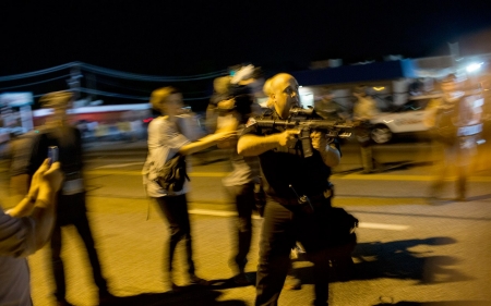 Policeman resigns after pointing rifle at Ferguson protesters