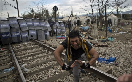 Police in Macedonia clash with refugees at border  