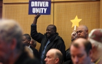 Seattle passes law letting Uber, taxi drivers
      unionize