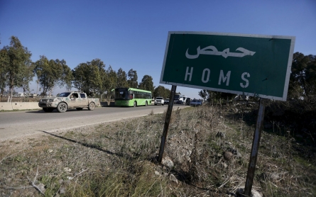 Syrians leave rebel-held Homs area in truce deal 