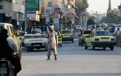  An ISIL policeman controls traffic in Raqqa on Sept. 18, 2014.