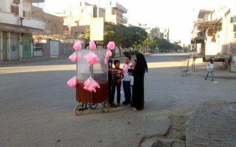 Syrian children buy cotton candy in Raqqa on Oct. 8, 2014. 