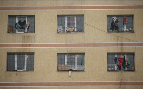 Laundry hangs from windows at the main refugee center on January 9, 2014 in Sofia, Bulgaria