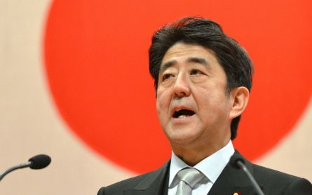 Japan PM retains party post for three more years