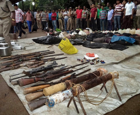 Arms seized from alleged Maoists are displayed at the district police headquarters after a gun battle with the guerrillas near Padia, on the border of Odisha and Chhattisgarh states, on Sept. 14, 2013.