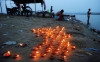 Earthen lamps are lit at the Triveni Sangam at dusk during Diwali celebrations in Allahabad, India on Nov. 3, 2013.