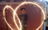 A Hindu youth waves sparklers during Diwali in Karachi, Pakistan on Nov. 3, 2013.