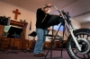 Pastor Matthew Butler at a lectern at the 1st Biker's Church of Texarkana, Texas, one of more than 100 bikers' churches in the U.S. and abroad. 