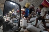 Residents loot water-damaged sacks of rice from a warehouse in Tacloban on Monday.