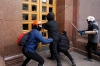 Protesters attempt to break in the door of the Kiev City State Administration building. 