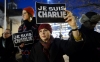 People gather for a rally in solidarity with the killed Charlie Hebdo employees, in Geneva, Switzerland.