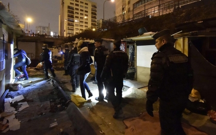 Photos: Police in Paris evacuate Roma encampment