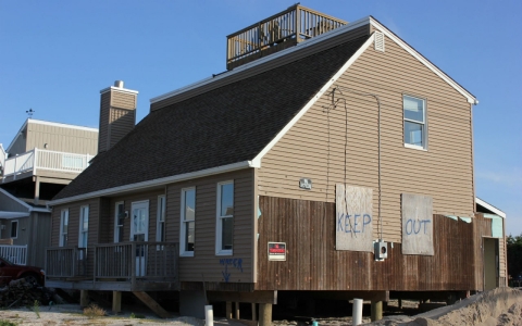 One of the homes in the Holgate section of Long Beach Island, N.J., that remains significantly damaged almost a year following Hurricane Sandy.