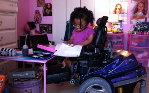 Hannah Brammer, 13, seen here in her room, has osteogenesis imperfecta, more commonly known as brittle bone disease.