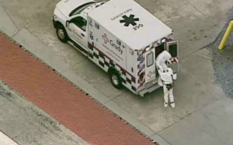 Dr. Crozier arriving at Emory University Hospital's biocontainment facility