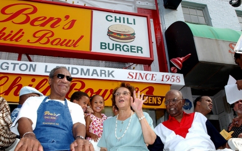 Bill Cosby joined Ben Ali, right, and Ali's wife, Virginia, during a celebration on the 45th anniversary of Ben's Chili Bowl in August 2003. 