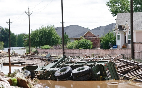 An M-923 U.S. military vehicle lays in a ditch in Longmont, Colo. on Sep. 16, 2013 after being washed away by flood waters.