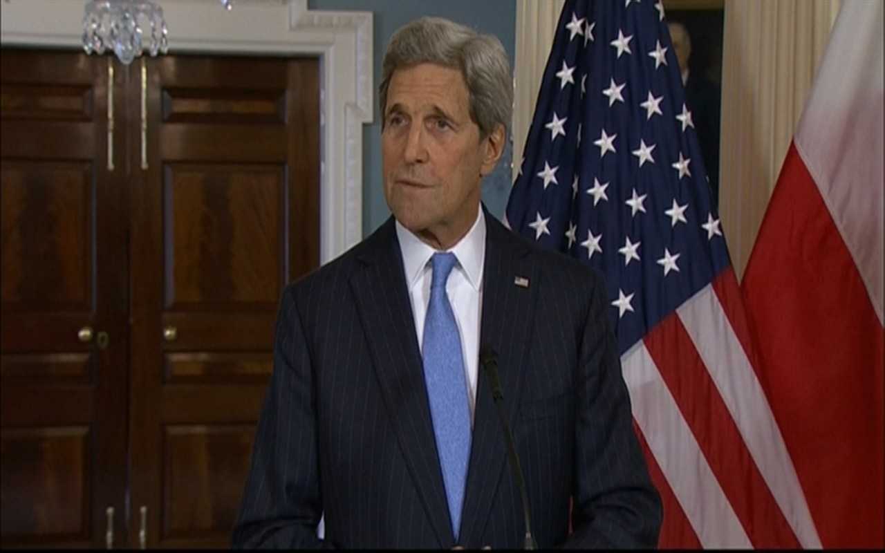 Secretary of State John Kerry reacts to the shooting in Paris